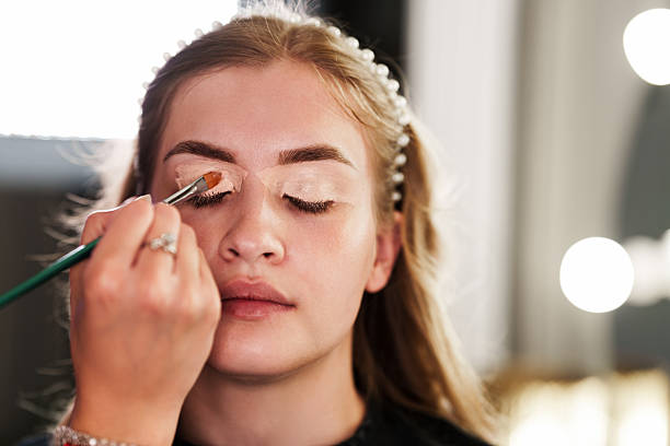 Concealer used as eyeshadow base on eyelids.