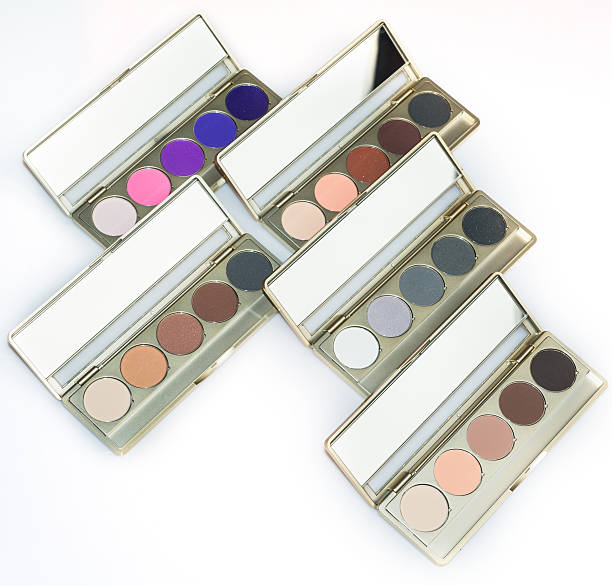 Slim travel eyeshadow palettes packed in a suitcase